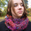 Random stitch bohemian cowl in magenta and purple yarn