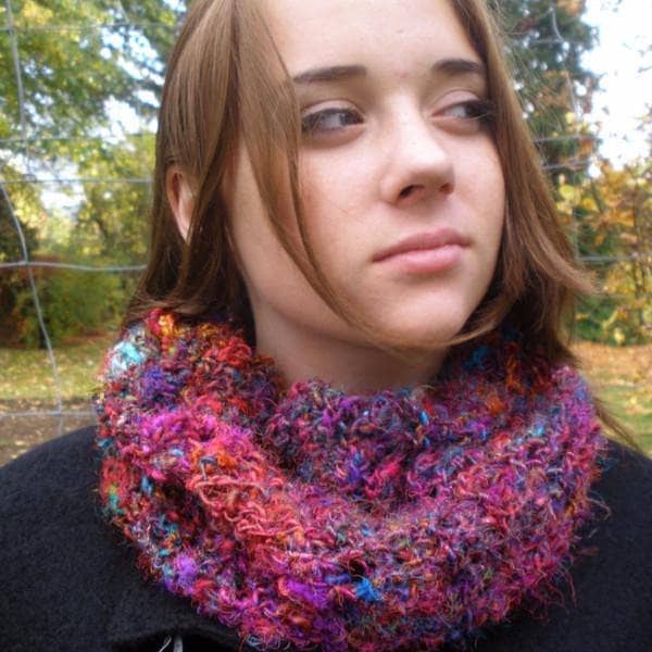Random stitch bohemian cowl in magenta and purple yarn