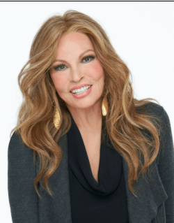 A woman wearing a sleek, long layered modern wig in RL2/4 Off Black.