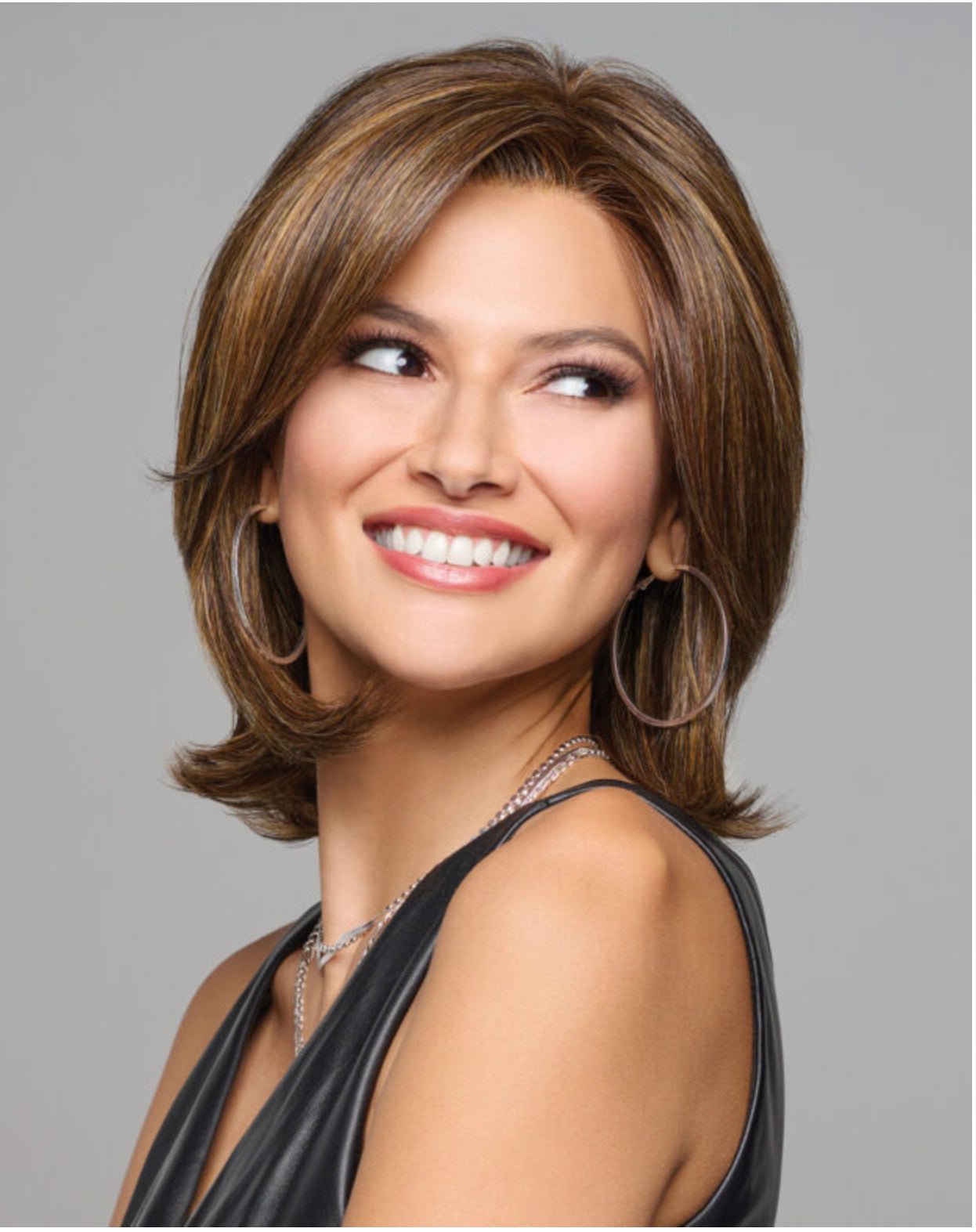 Raquel Welch Take A Bow chin-length layered wig in RL16/21SS Shaded Sand