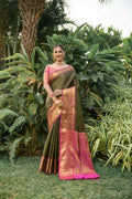 Sophisticated black Kanjivaram silk saree with shimmering zari work and a pink blouse