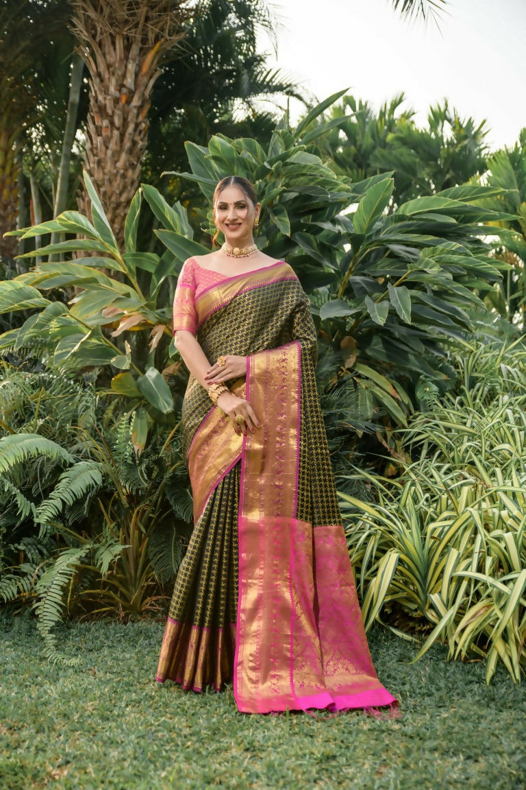 Sophisticated black Kanjivaram silk saree with shimmering zari work and a pink blouse