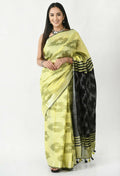 Lemon yellow and black Bhagalpuri handloom Ikat cotton saree with traditional geometric patterns