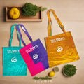 A unique, eco-friendly tote bag handmade from colorful, vibrant reclaimed sari silk fabric.