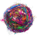 Close up of Wild Peacock colored worsted weight recycled sari silk yarn in a ball
