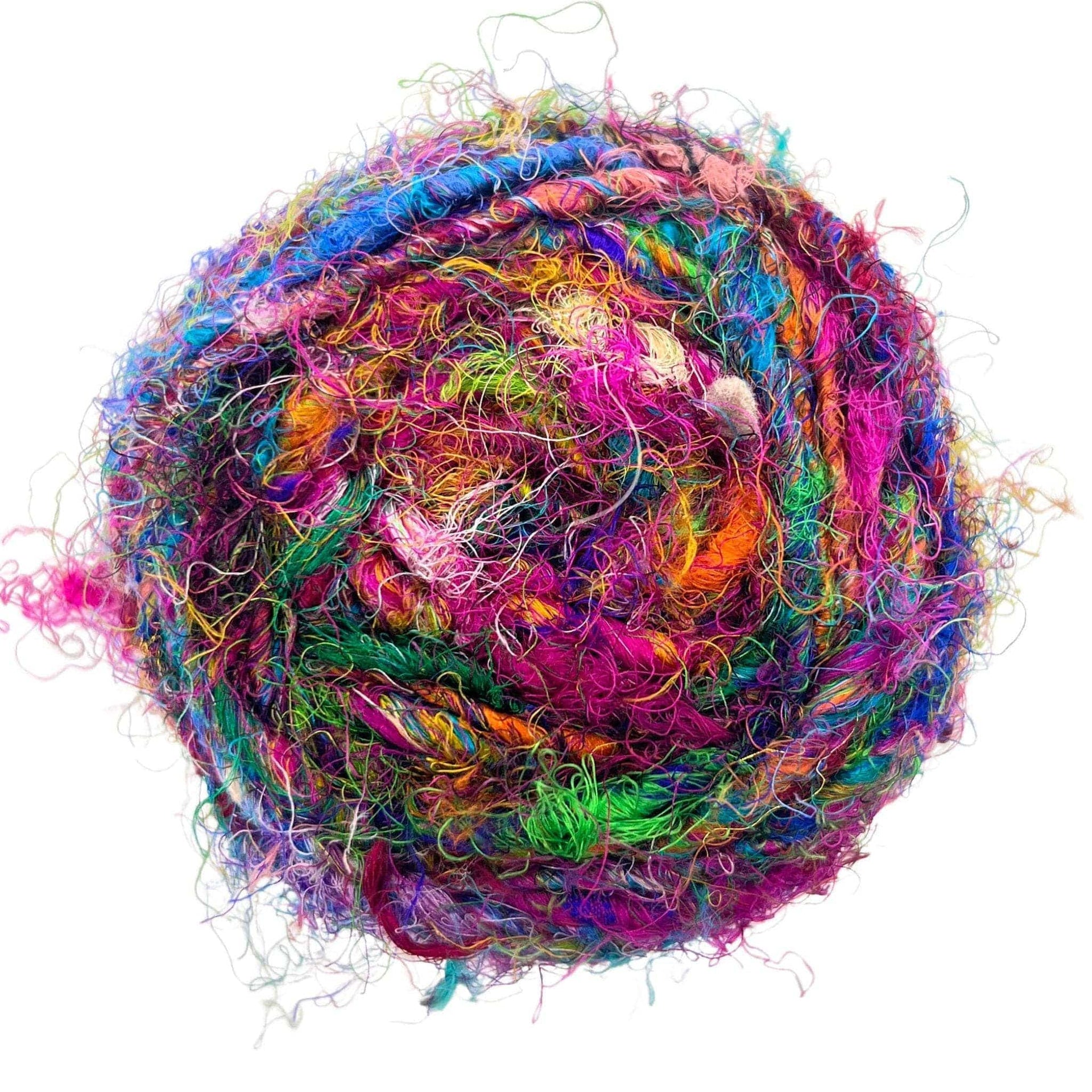 Close up of Wild Peacock colored worsted weight recycled sari silk yarn in a ball