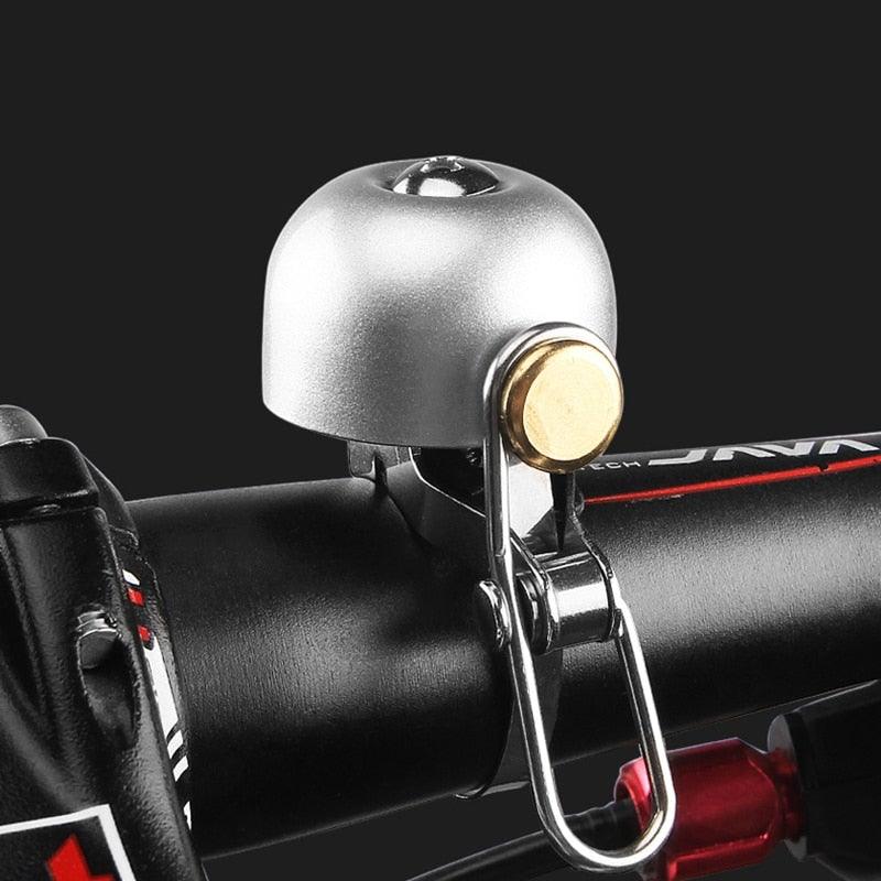 Vintage style stainless steel bicycle bell mounted on bike handlebars