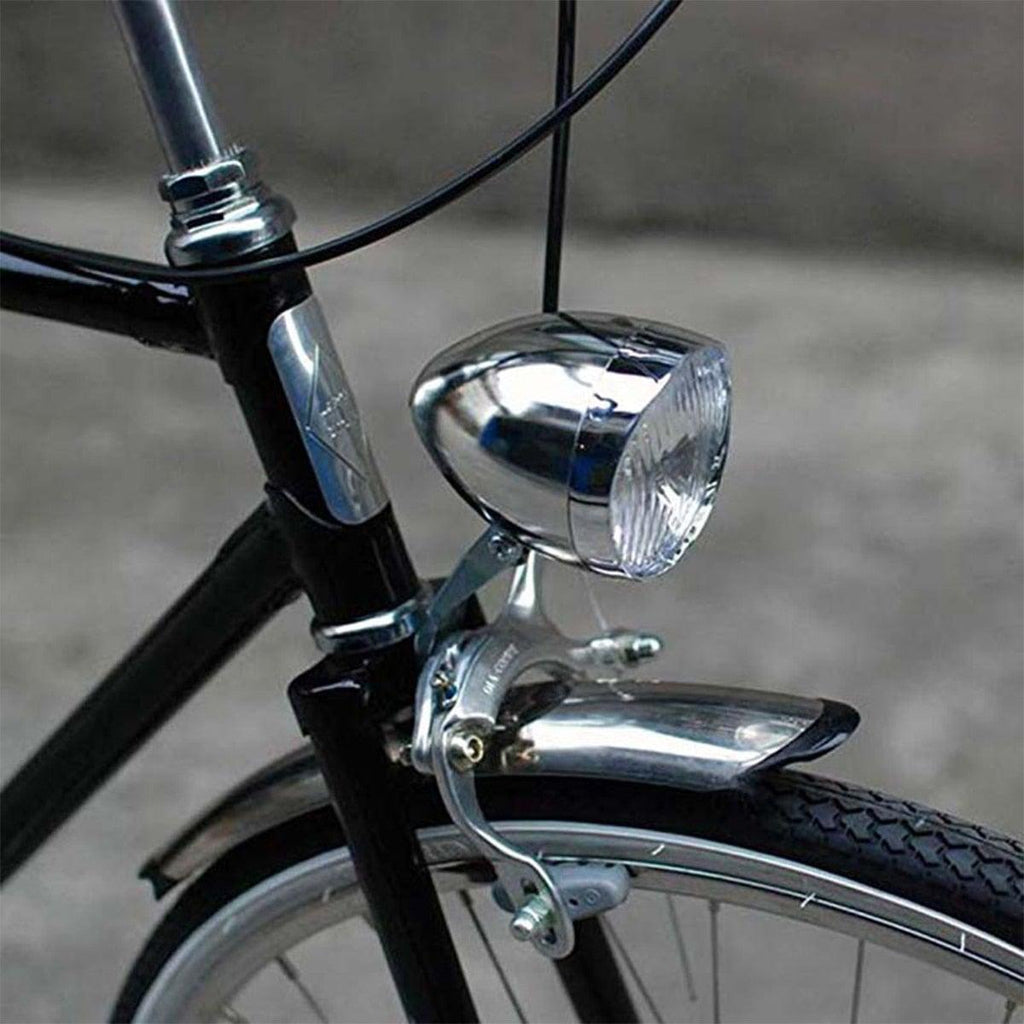 Classic retro bicycle headlight in silver finish with vintage aesthetic design.