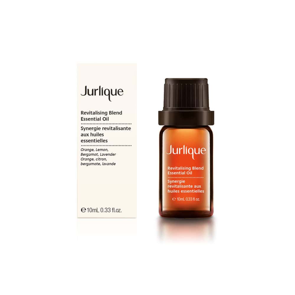 Jurlique Revitalizing Blend Essential Oil in an amber glass bottle with cream packaging.