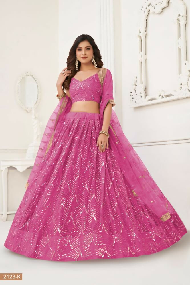 Aastha Fashion Pink Butterfly Net Lehenga Choli with intricate thread, sequence, and mirror work embroidery for wedding wear.