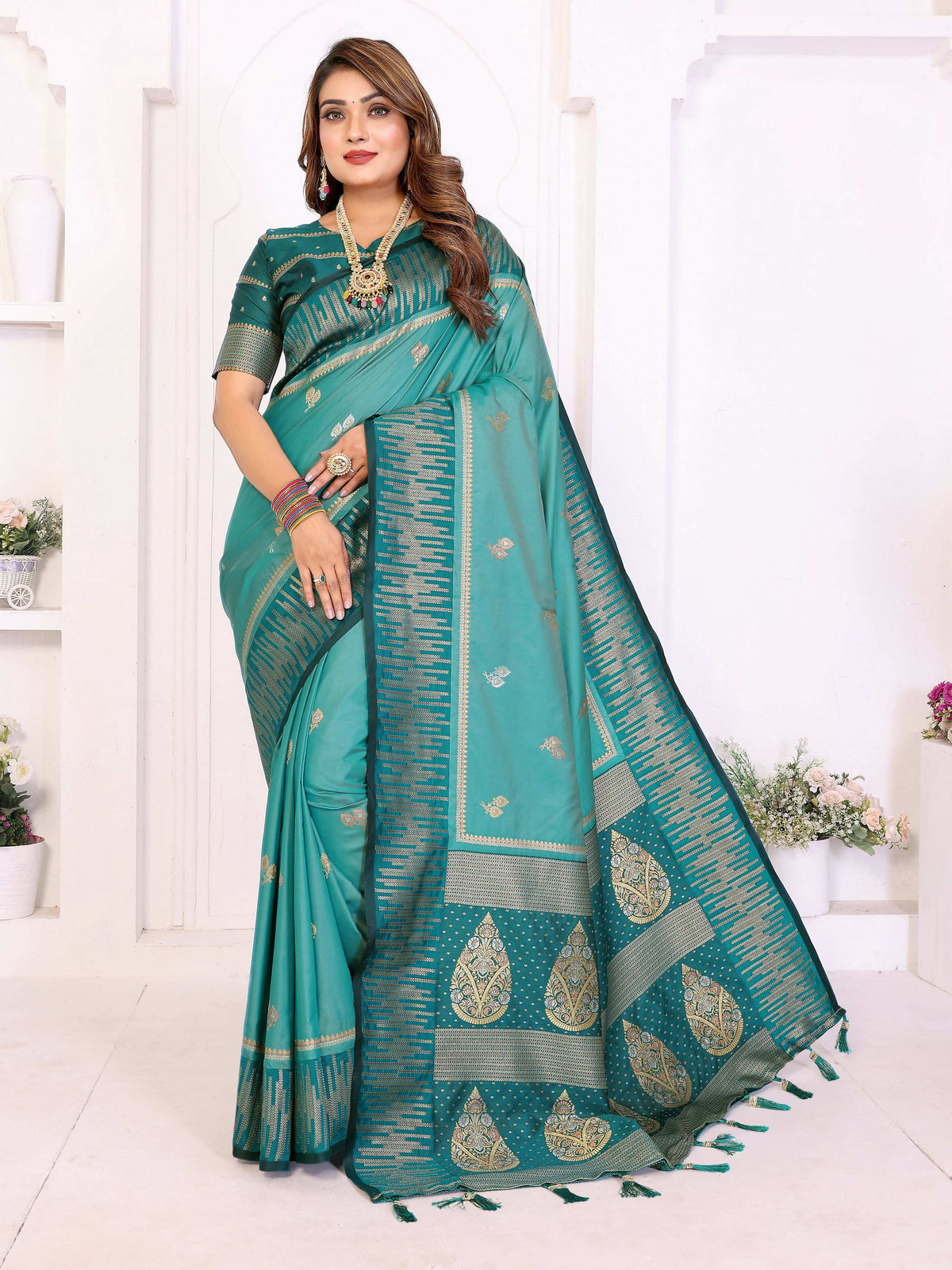 An Aqua South Soft Silk Saree with detailed Zari weaving patterns.
