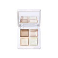 Open Living Luminizer Glow Quad Mini compact showing four shimmering highlighting and bronzing balm shades.