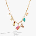 Road Trip multi-charm necklace featuring enamel charms of a car key, traffic light, and suitcase on a gold chain.