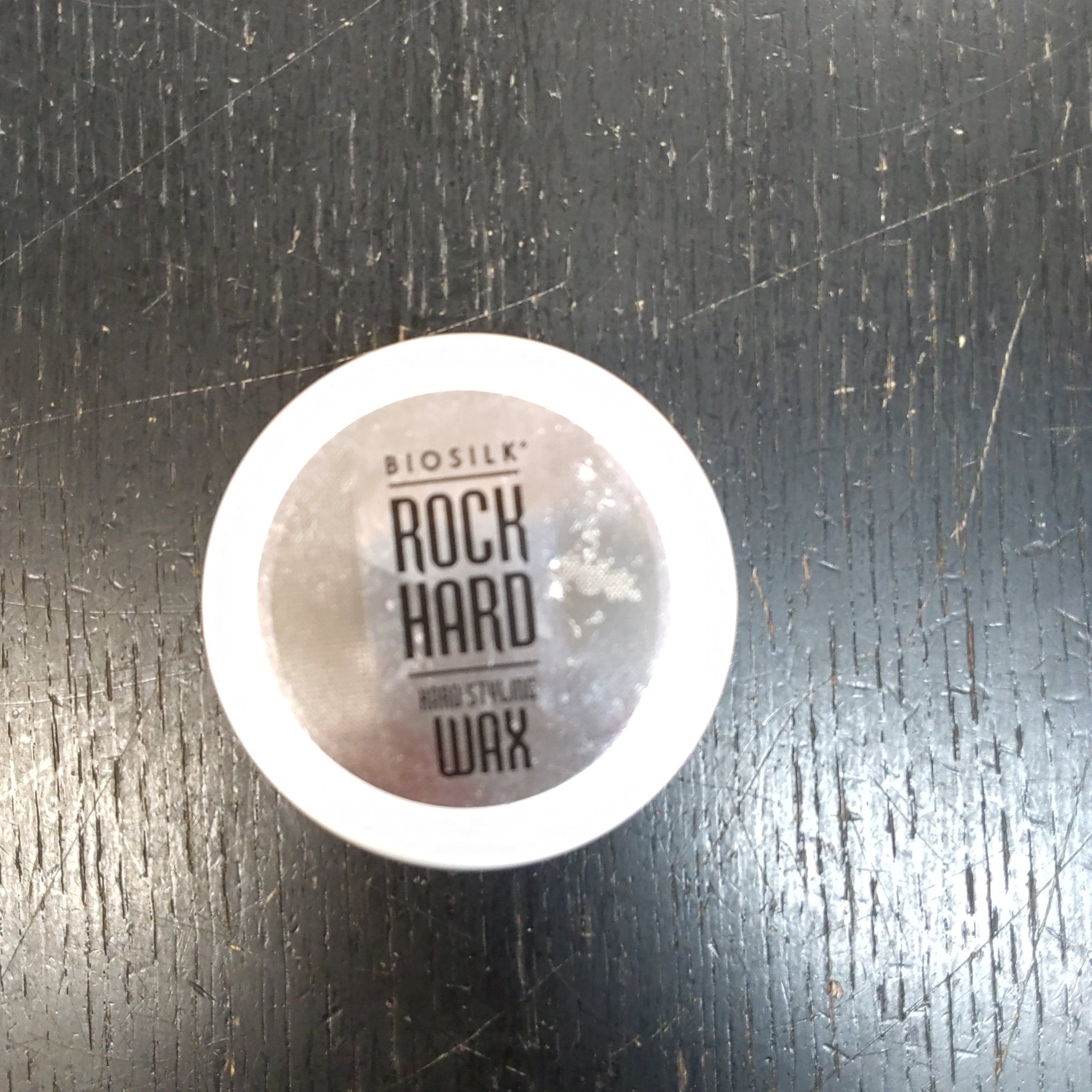 BIOSILK Rock Hard Styling Wax 1.9 oz jar in metallic silver and white packaging