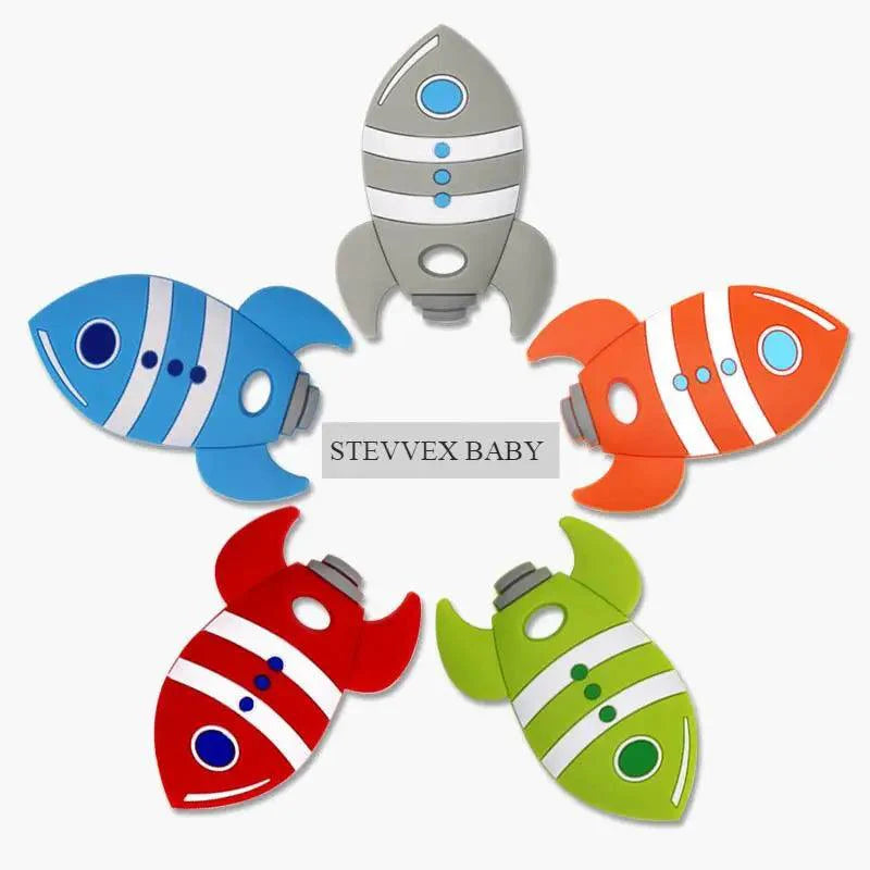 Rocket-shaped silicone baby teether in assorted colors for infant gum relief