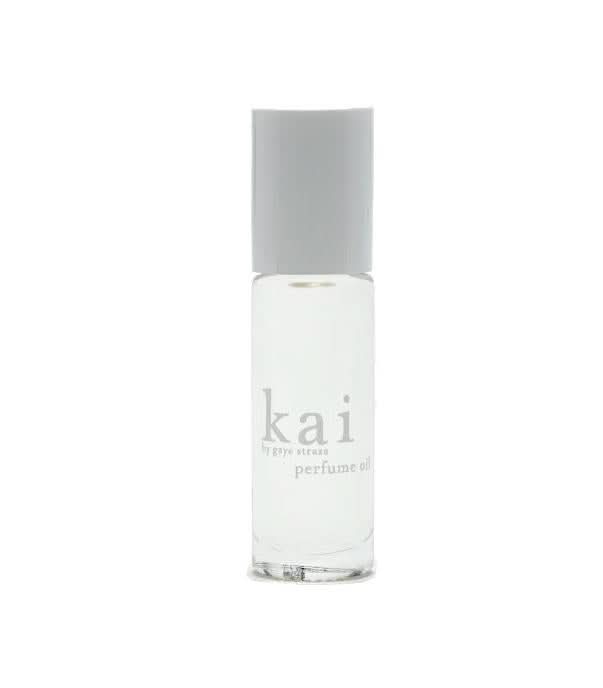 Minimalist clear roll-on perfume oil bottle by Kai with white branding