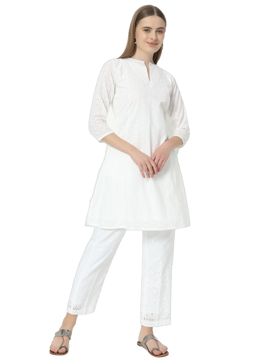 Woman wearing a stylish white Chikankari co-ord set with a round cut neck