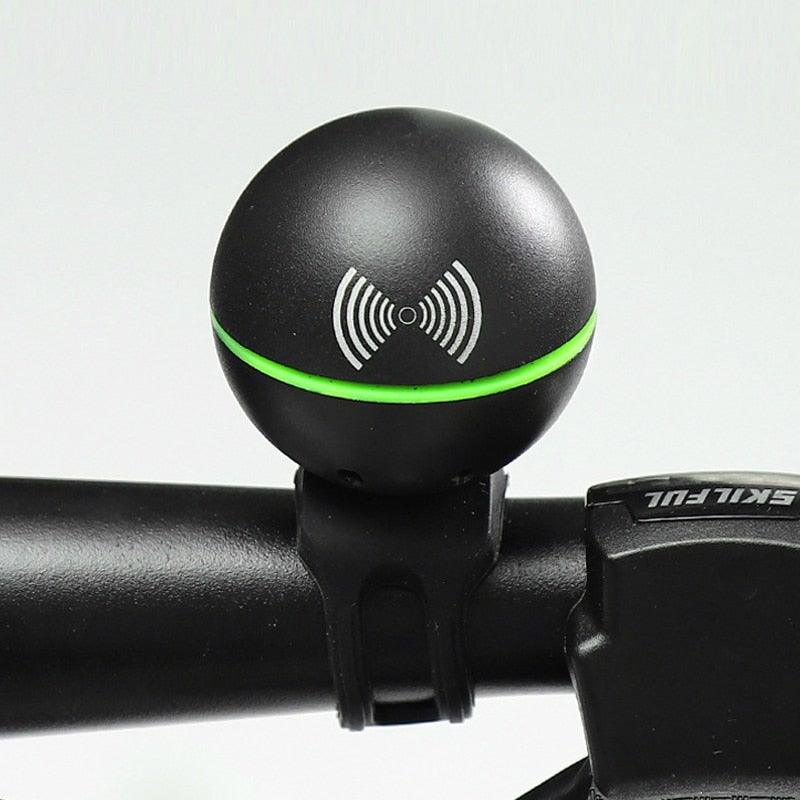 Modern round electric bicycle horn in black finish mounted on a bicycle handlebar