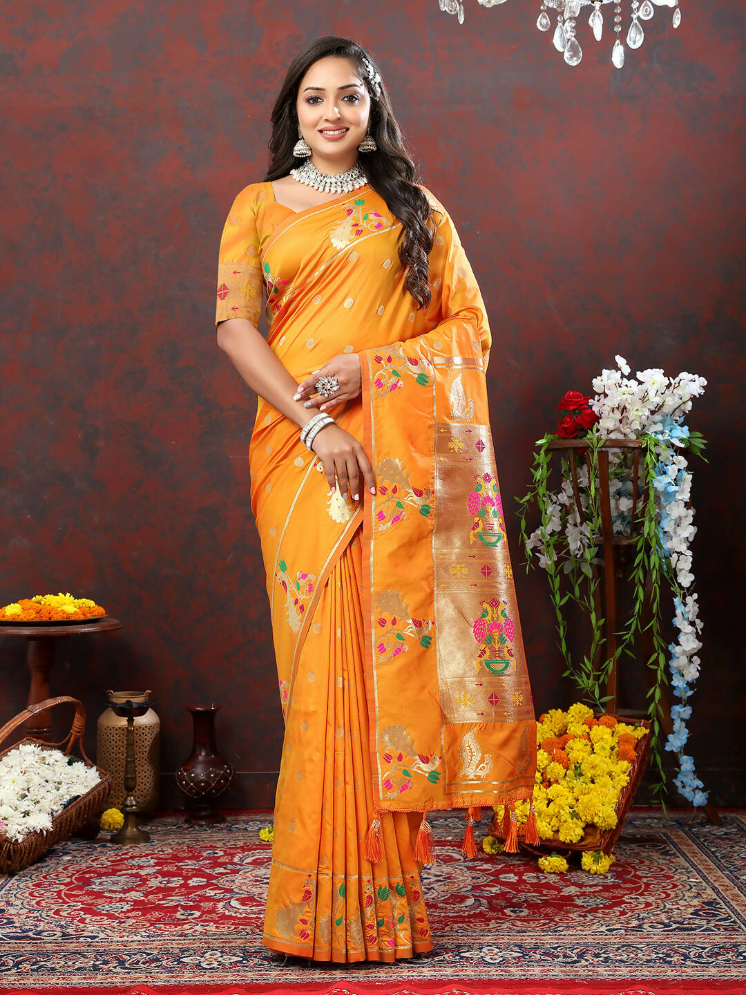 Vibrant orange soft Paithani silk saree with detailed gold zari meenakari work