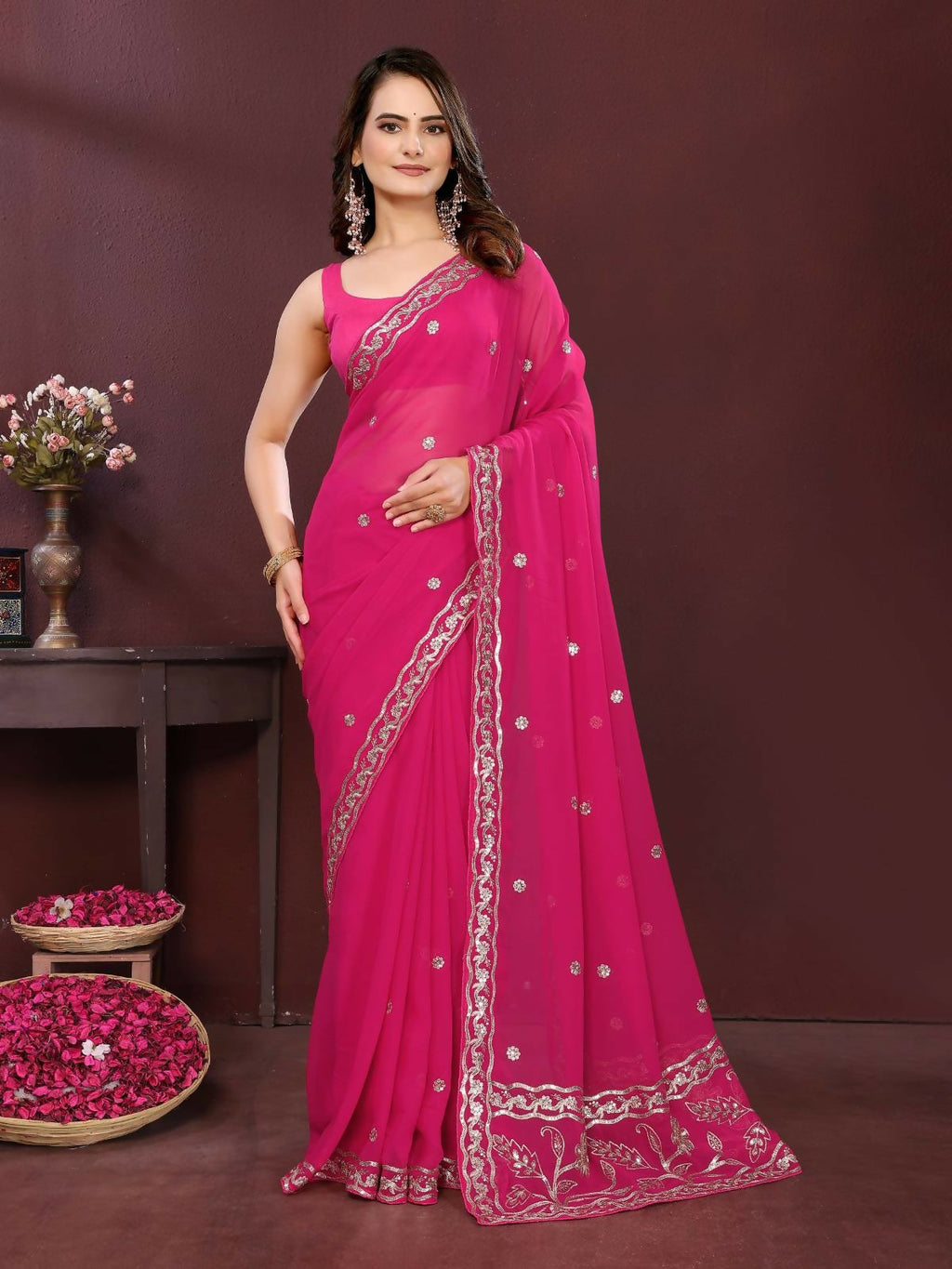 Pink soft georgette saree featuring intricate embroidery and matching blouse piece