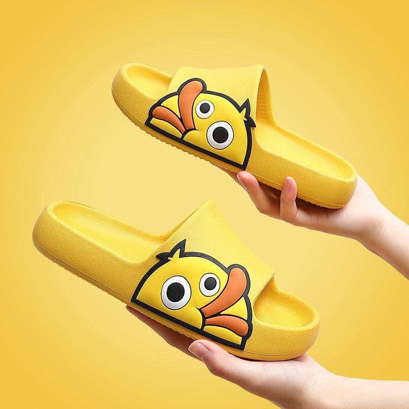 A pair of plush memory foam winter slides with a thick, waterproof sole.
