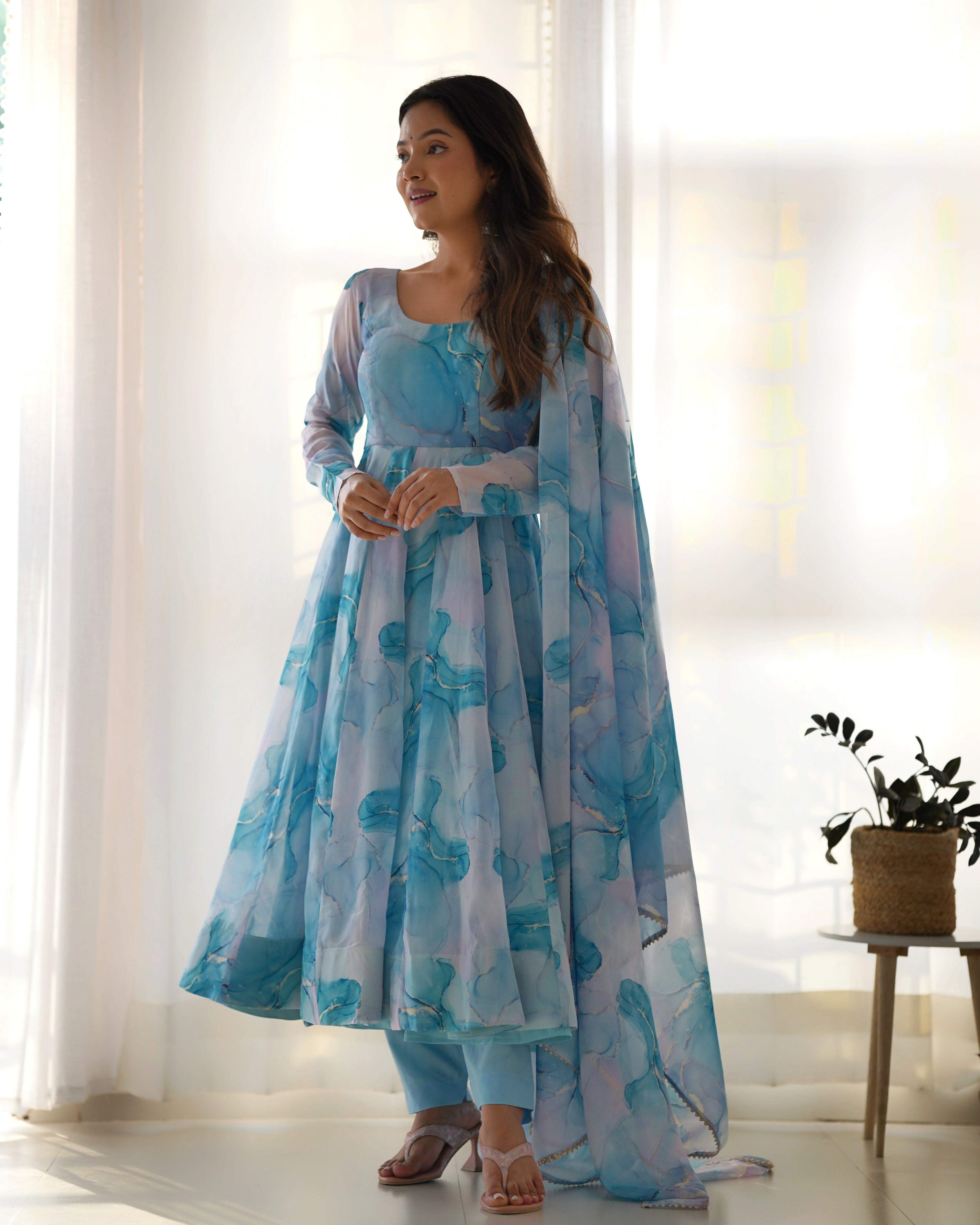Sky organza kurta set featuring delicate sequin embroidery and matching cotton pants