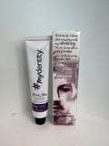 A 2 oz tube of Mydentity 9NI Light Neutral Blonde permanent hair color in white and purple packaging.