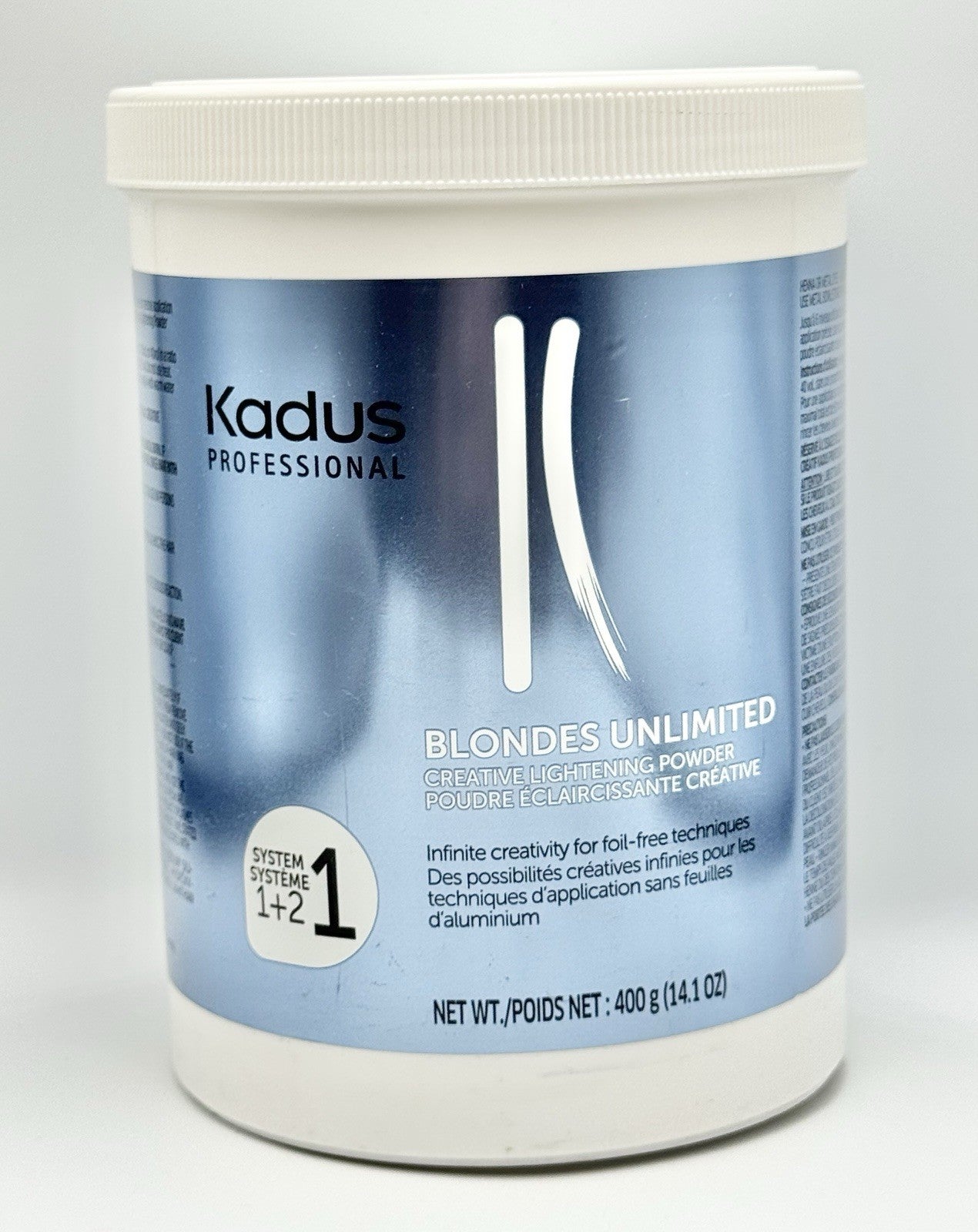 Jar of Kadus Professional Blondes Unlimited Creative Lightening Powder in metallic blue and white packaging.