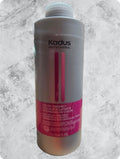 Neutral grey bottle of Kadus Professional Color Vibrancy Post-Color Treatment with magenta branding accents.