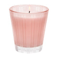 Modern striped pink and clear glass Nest New York Himalayan Salt & Rosewater candle on a minimalist surface