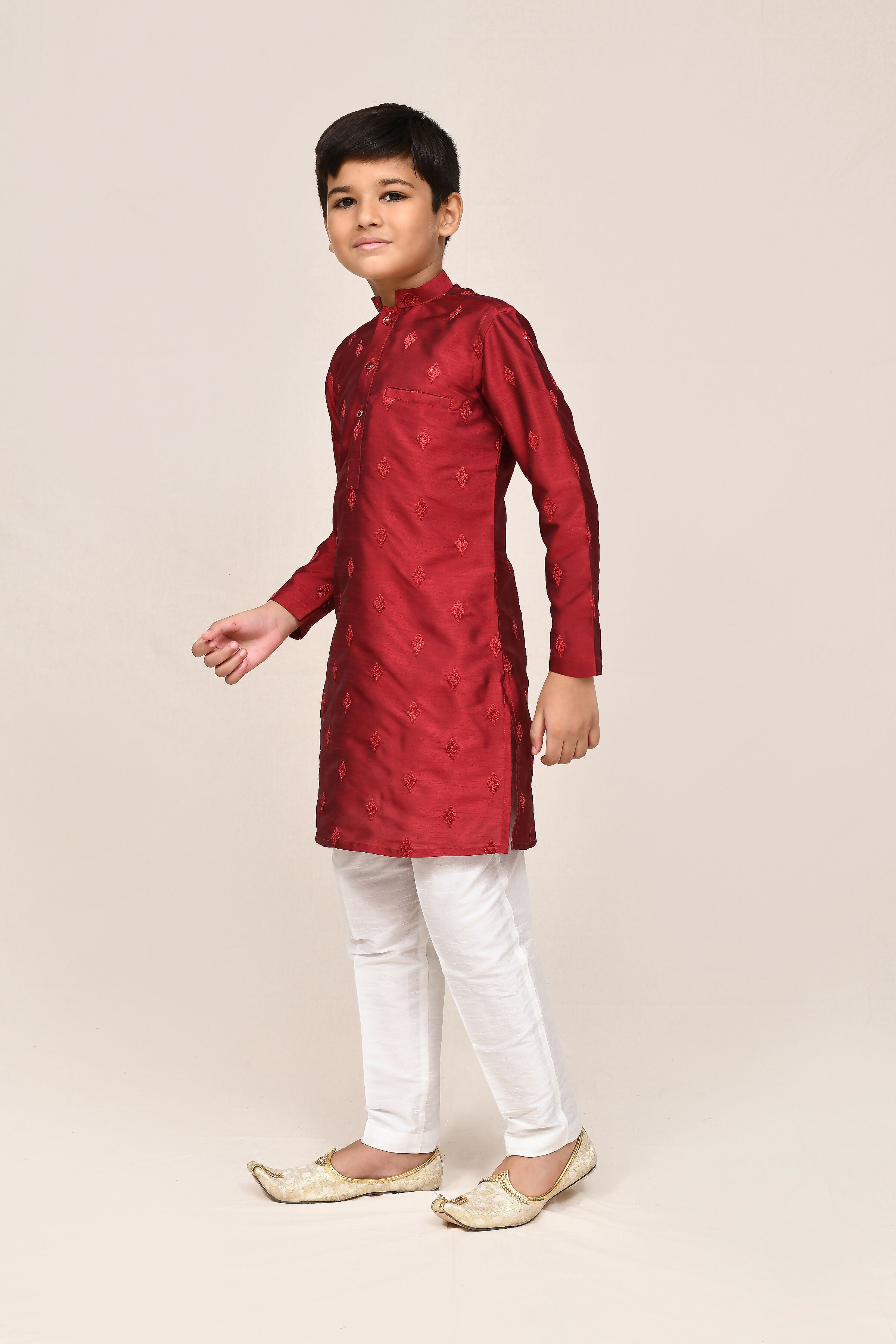 Rich maroon silk kurta with intricate thread work and white straight-fit pants