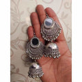 A pair of elegant artificial silver fashion earrings for women displayed on a neutral background.