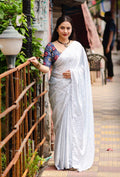 White poly silk saree with ethnic mango motifs and fancy cutwork border