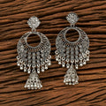 A pair of silver black oxidised metal earrings for women, featuring intricate traditional patterns.