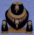 Exquisite gold plated Kundan stone studded necklace set with intricate design
