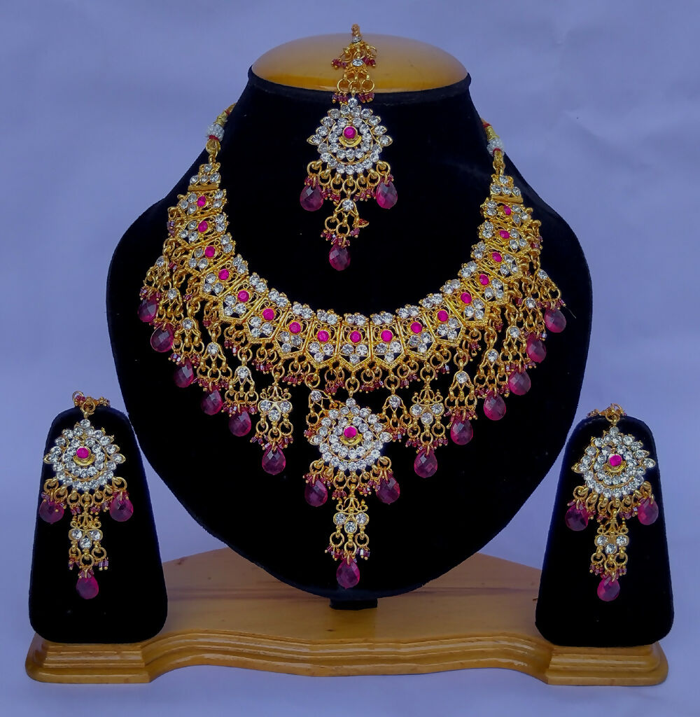 Exquisite gold plated Kundan stone studded necklace set with intricate design