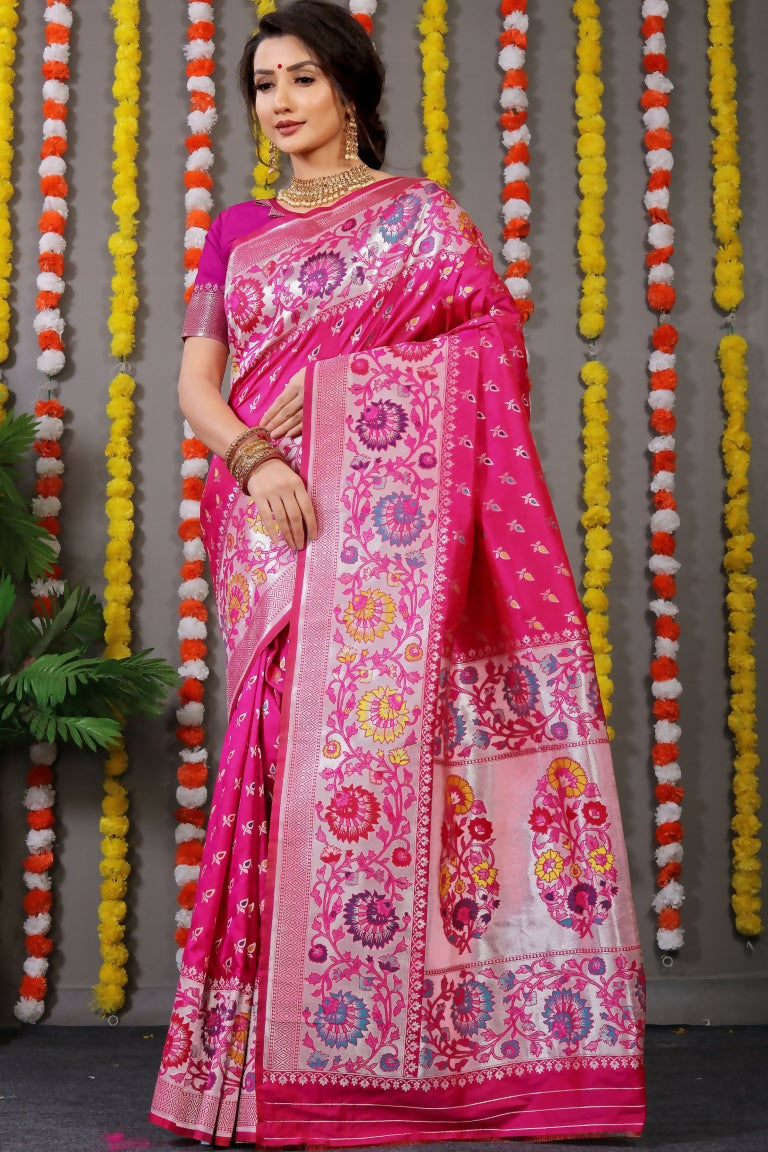 A beautiful Rani Pink Banarasi silk saree with intricate zari woven patterns and matching blouse.