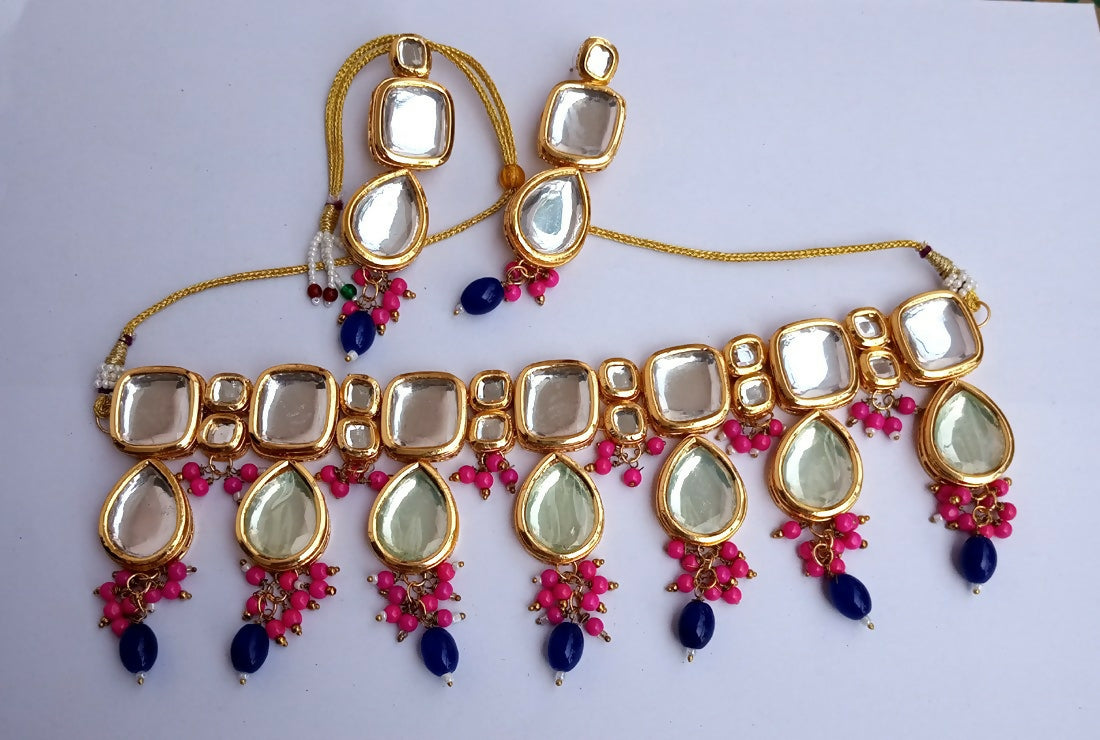 Pink and blue Kundan stone necklace set with gold-plated details and adjustable cord
