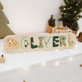 Personalized wooden safari animal name puzzle for toddlers on a white background