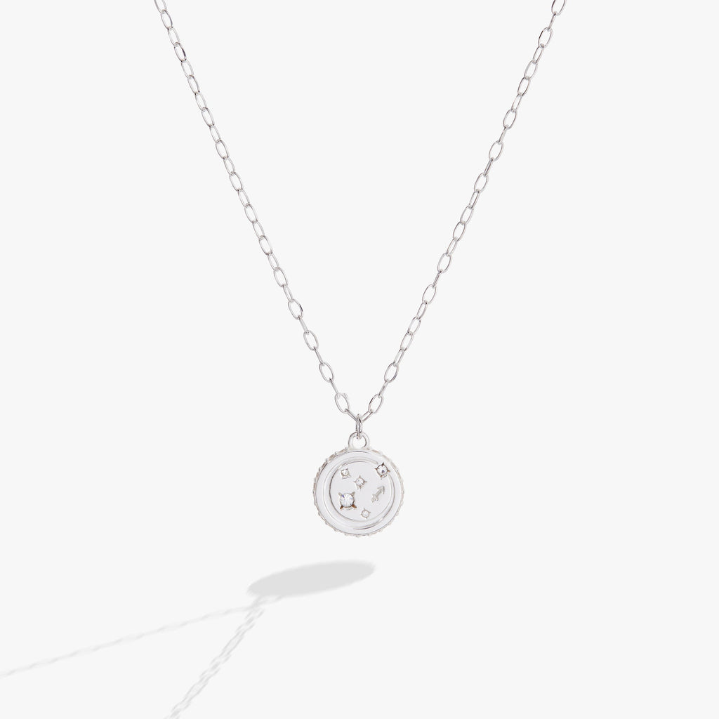 Silver-tone Sagittarius zodiac pendant necklace with crystal accents and double-sided engraving.