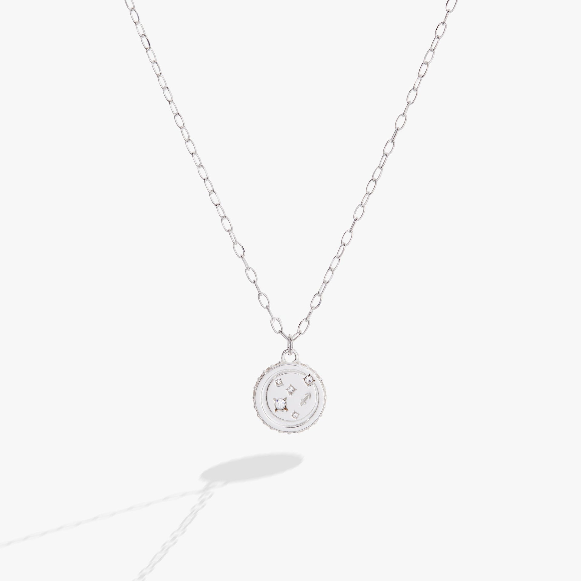 Silver-tone Sagittarius zodiac pendant necklace with crystal accents and double-sided engraving.