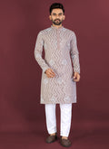 Beige soft silk A-line kurta with white thread embroidery and silver sequins