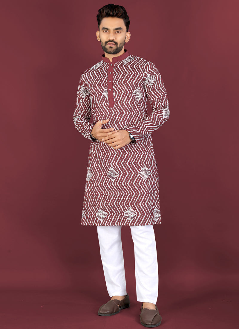 Maroon soft silk A-line kurta featuring white thread embroidery in a cross pattern and silver sequence detailing.