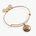 Gold and silver Sand Dollar charm bangle featuring crystal details and an engraved blessing on a neutral background.