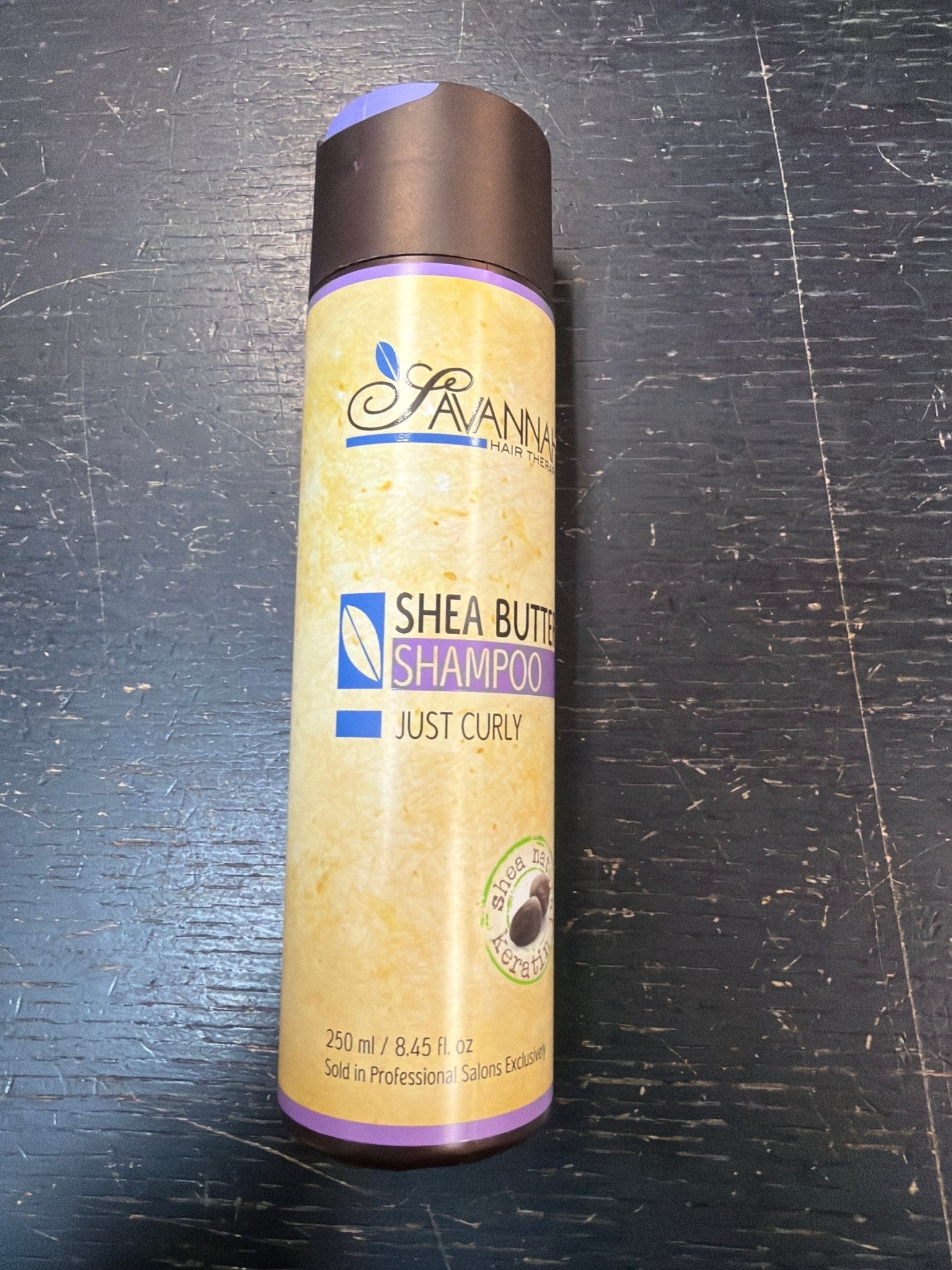 Bottle of Savannah Hair Therapy Shea Butter Shampoo for curly hair