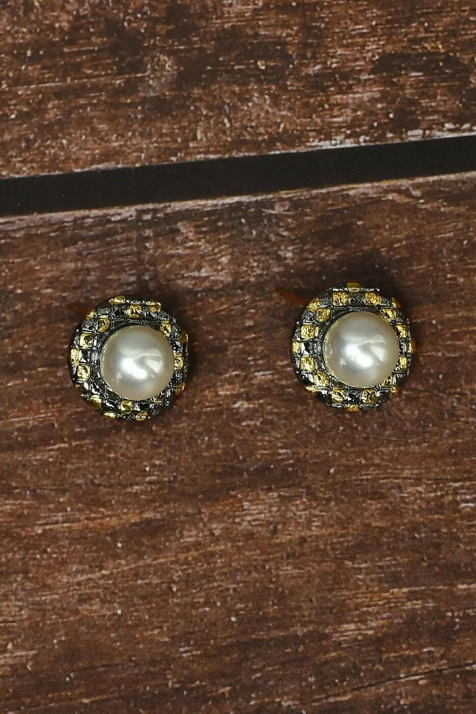 A pair of elegant Golden White AD stone earrings crafted in brass for a luxury festive look.