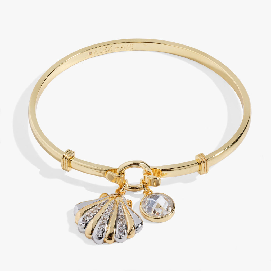 Two-tone silver and gold seashell tension bangle with pave crystal scallop charm and faceted crystal