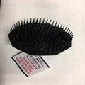 Scalpmaster Shampoo Brush in black, compact ergonomic hair care tool for scalp massage