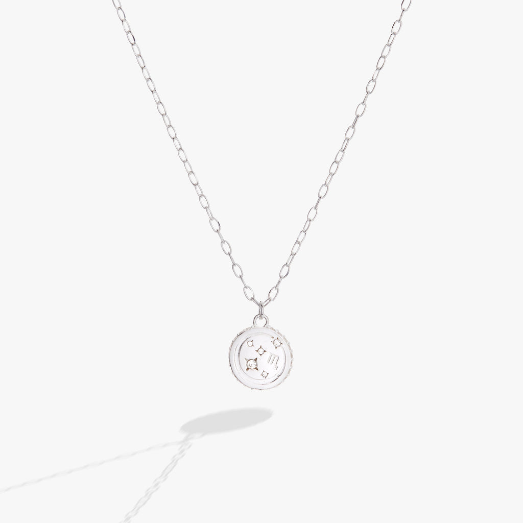 Scorpio zodiac pendant necklace with double-sided engraving and crystal accents.