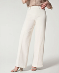 Front view of SPANX ecru wide-leg jeans with seamed front detail on a model